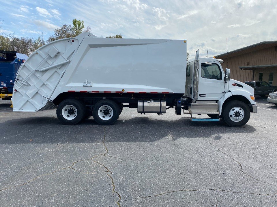 2024 Peterbilt 548 with Reconditioned McNeilus Rear Loader System