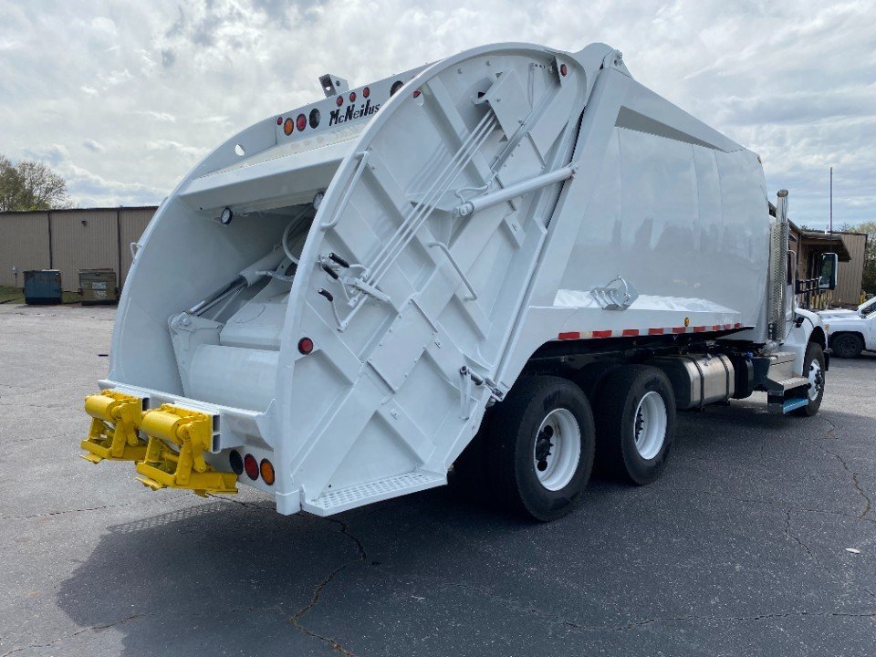 2024 Peterbilt 548 with Reconditioned McNeilus Rear Loader System