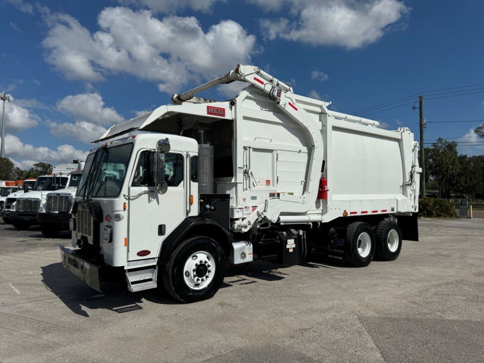 Reconditioned with New Paint! 2023 Peterbilt 520 Heil Half Pack 28 yd. 