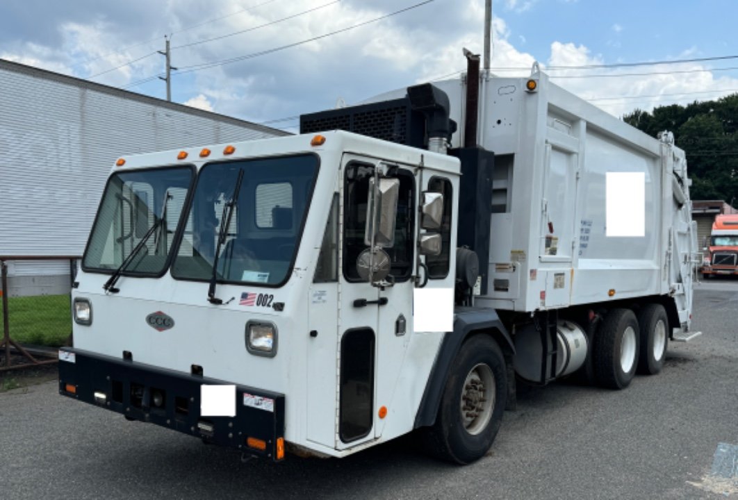 2014 CCC Rear Load Packer with Cart Tippers