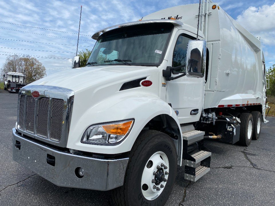 2024 Peterbilt 548 with Reconditioned McNeilus Rear Loader System